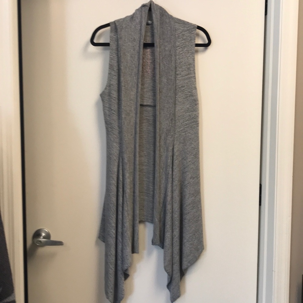 Long sweater vest wrap. Detailing on the back.